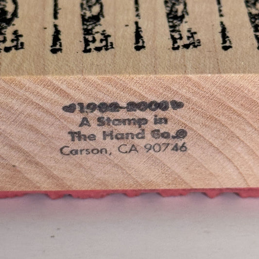 A Stamp In The Hand Rubber Stamp Distressed Lines Background Stripes Grunge Wood Texture
