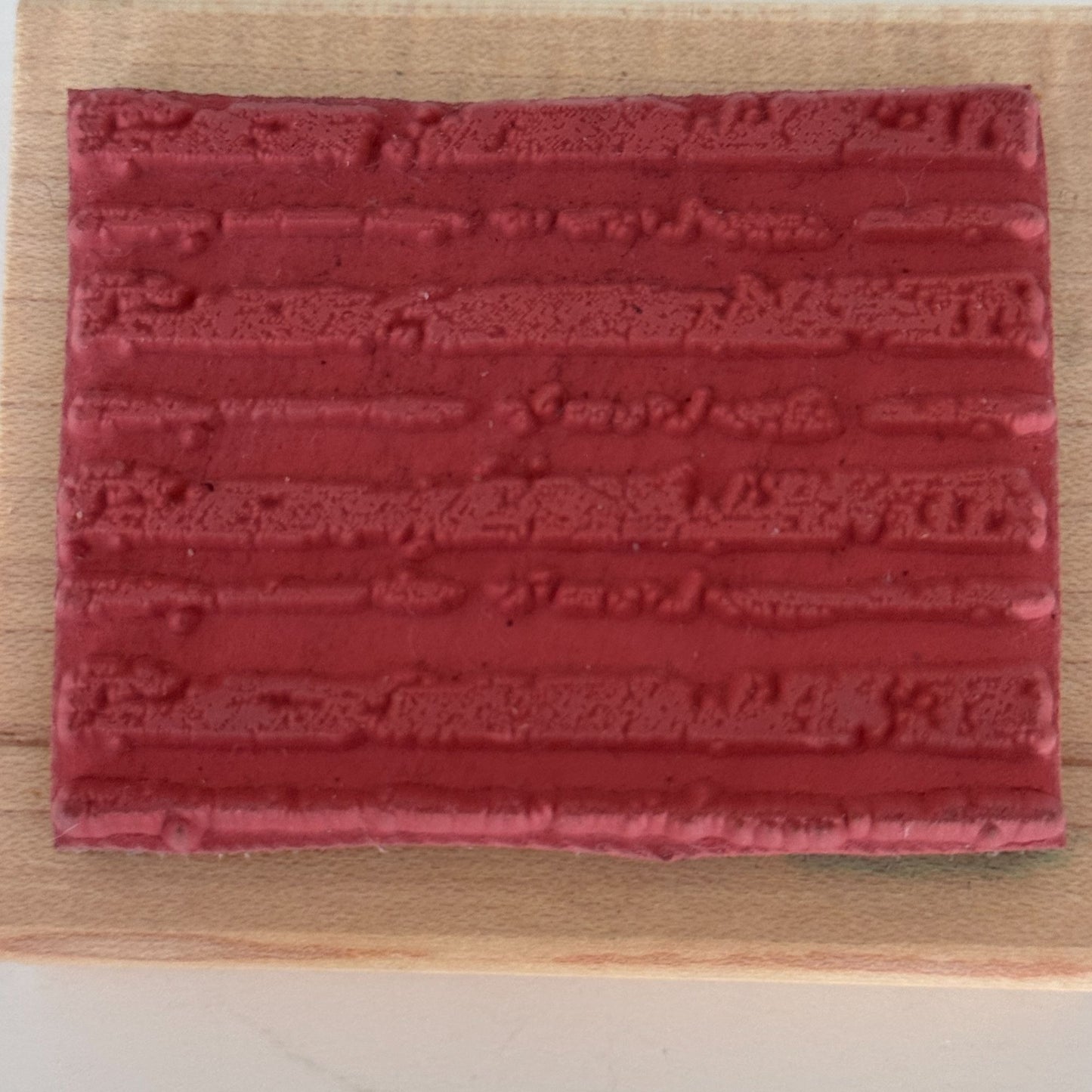 A Stamp In The Hand Rubber Stamp Distressed Lines Background Stripes Grunge Wood Texture