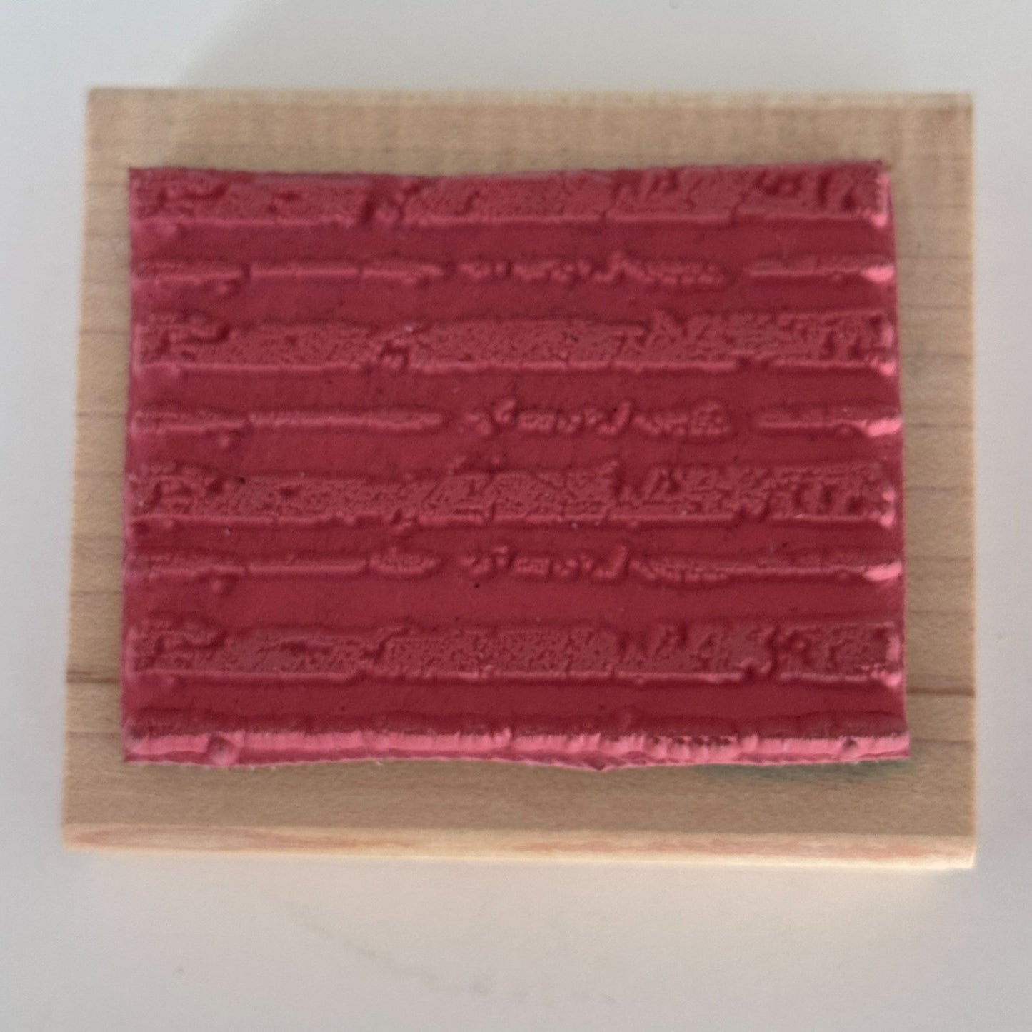 A Stamp In The Hand Rubber Stamp Distressed Lines Background Stripes Grunge Wood Texture