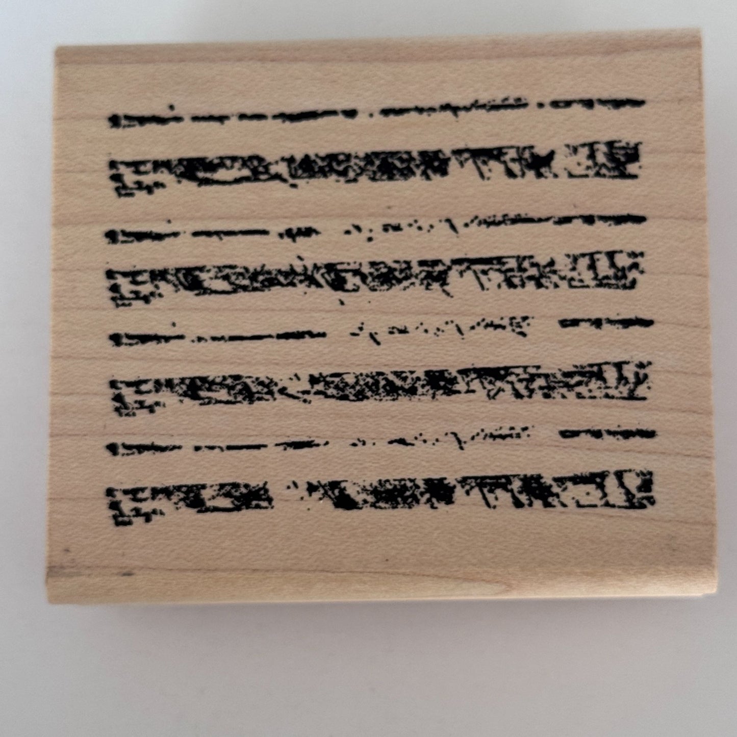 A Stamp In The Hand Rubber Stamp Distressed Lines Background Stripes Grunge Wood Texture